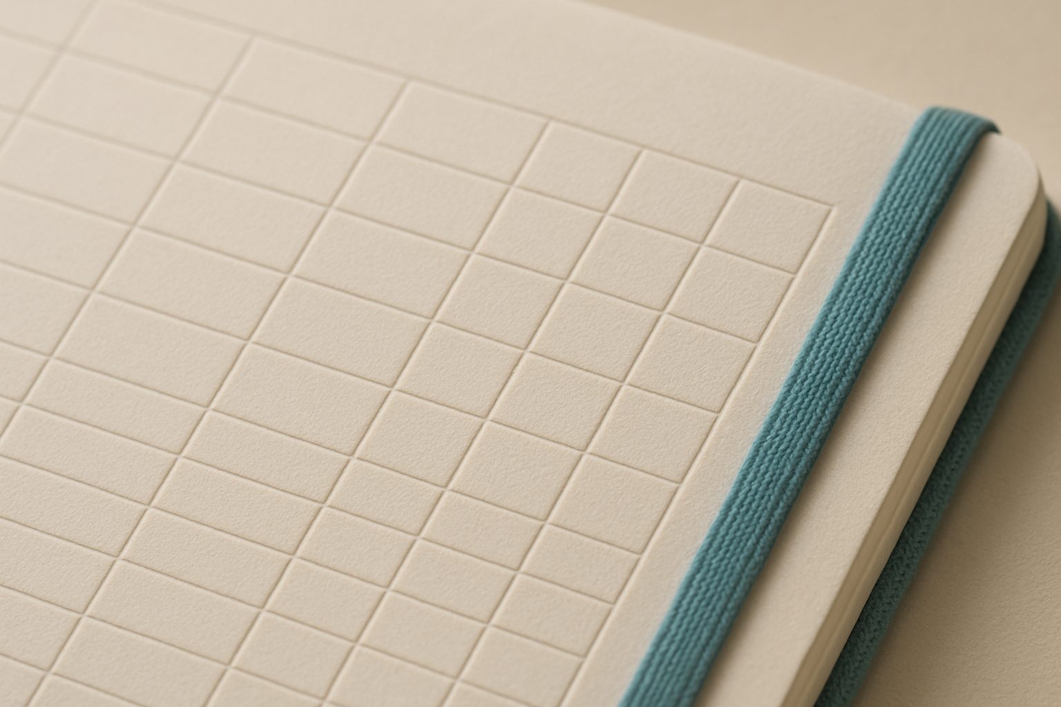 Embossed ledger grid on cream paper